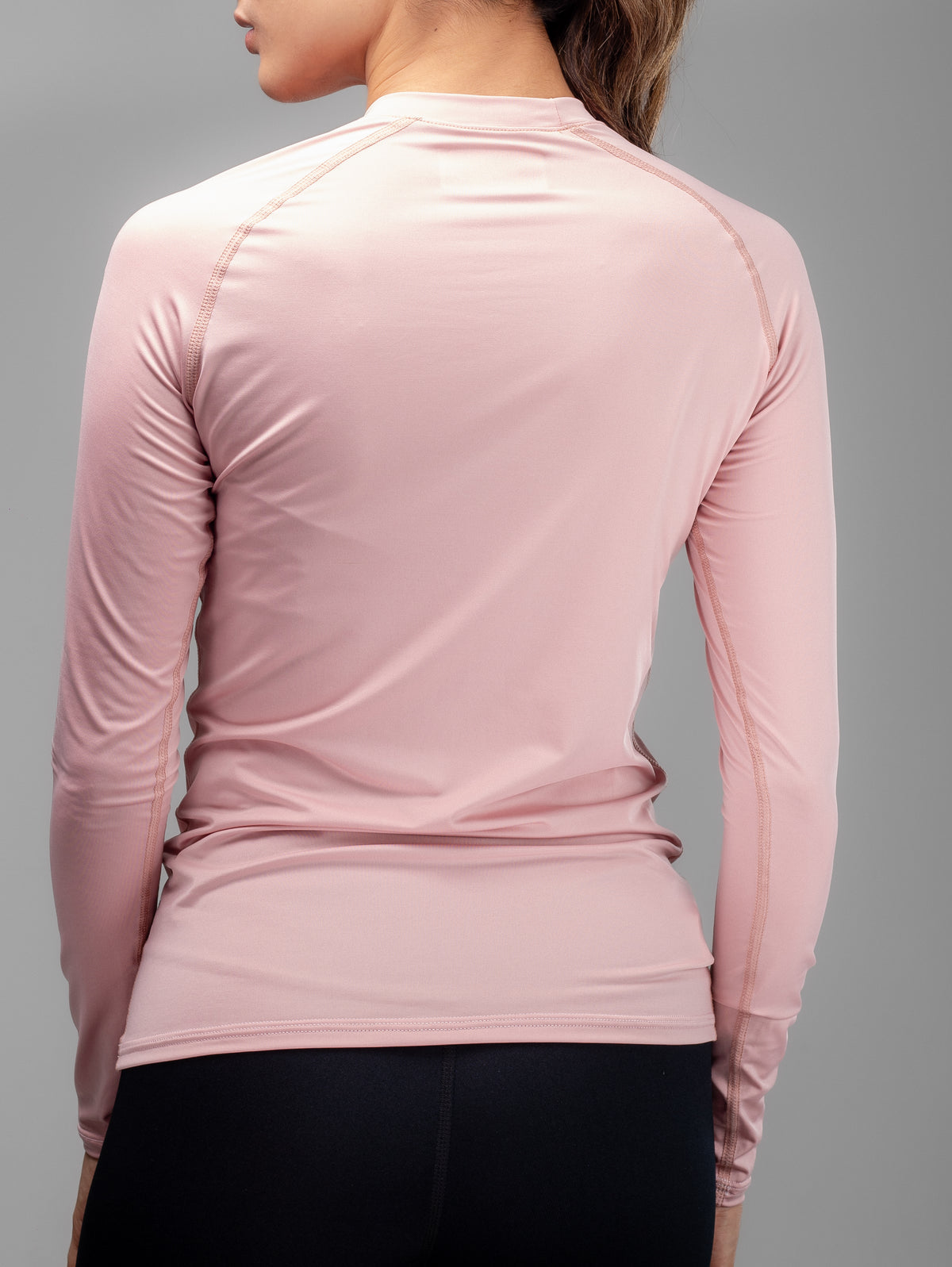 Buzo Compresión MLM 2 para mujer en rosado claro, vista posterior