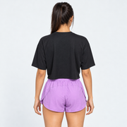 Vista posterior de Blusa Over Crop 1 negra de Grama, diseño oversized con hombros caídos y corte crop