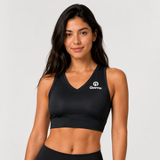 Top Niza negro para mujer vista frontal con cuello V, banda inferior y logo Grama