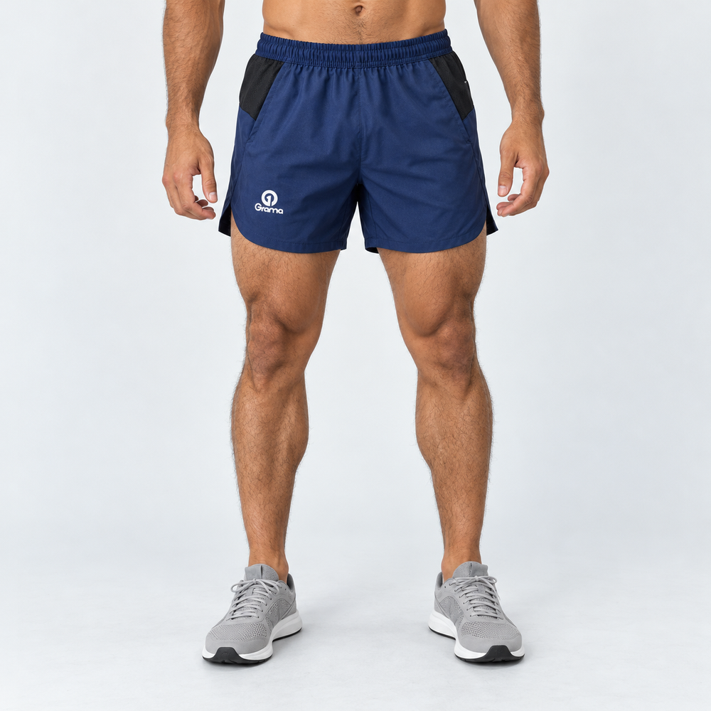 Pantaloneta Ruman azul para hombre, vista frontal con pretina elástica, paneles negros y logo Grama blanco.