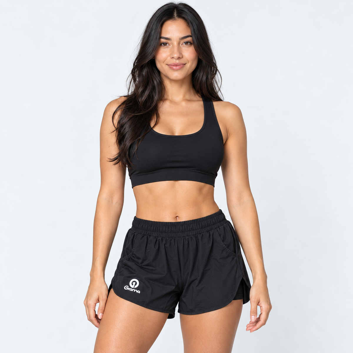 Pantaloneta deportiva Tabita II negra para mujer, vista frontal con bolsillos y pretina elástica