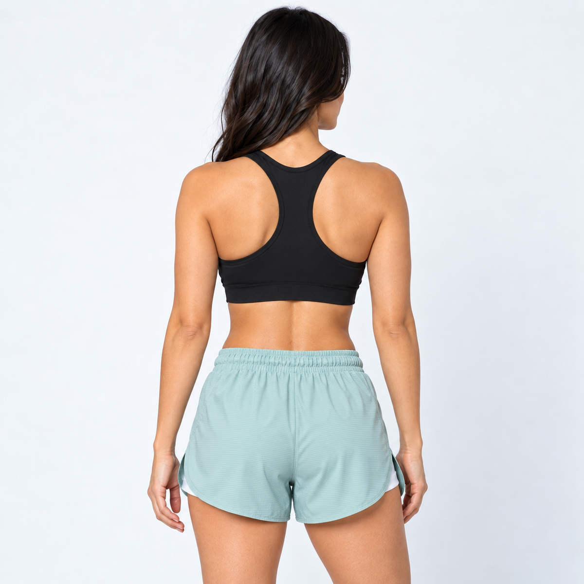 Vista posterior de la pantaloneta Tabita II verde menta con bordes curvos y capa interior blanca