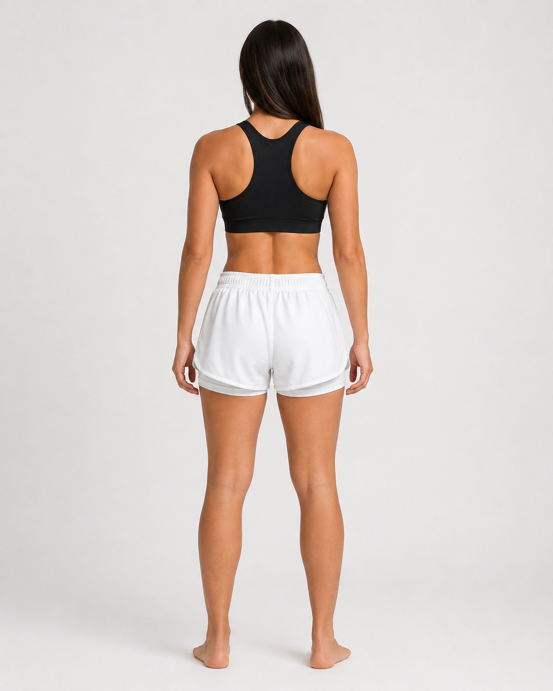 Short Lotus blanco para mujer, vista posterior con pretina elástica y short interior visible.