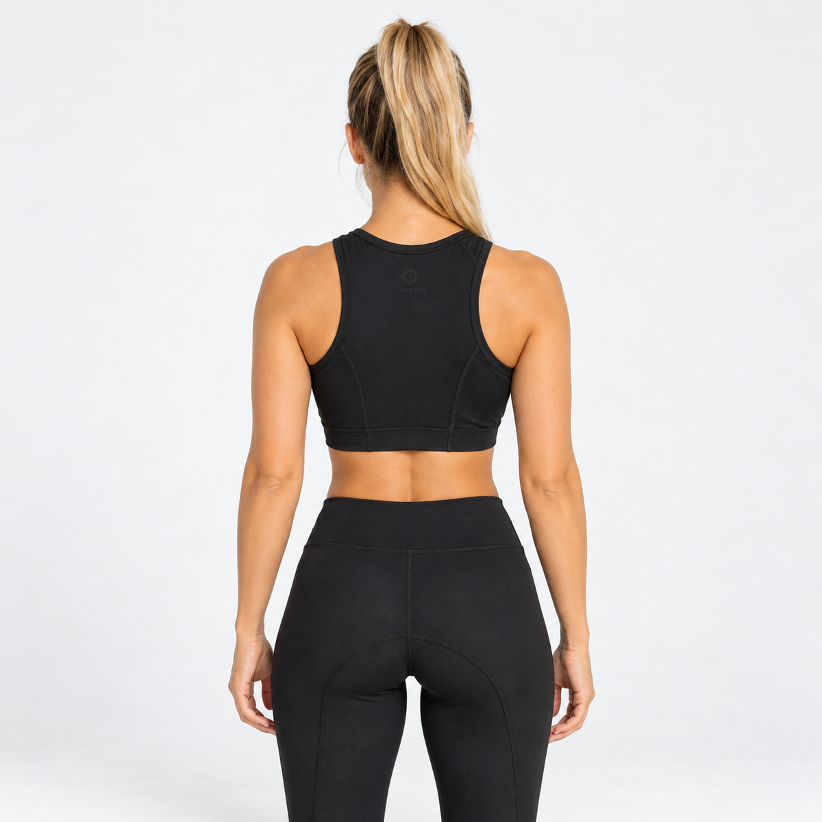Top deportivo Niza negro para mujer Grama, vista posterior